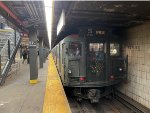 A rear view of the Arnine consist stopped at 57th St Station during a delay 